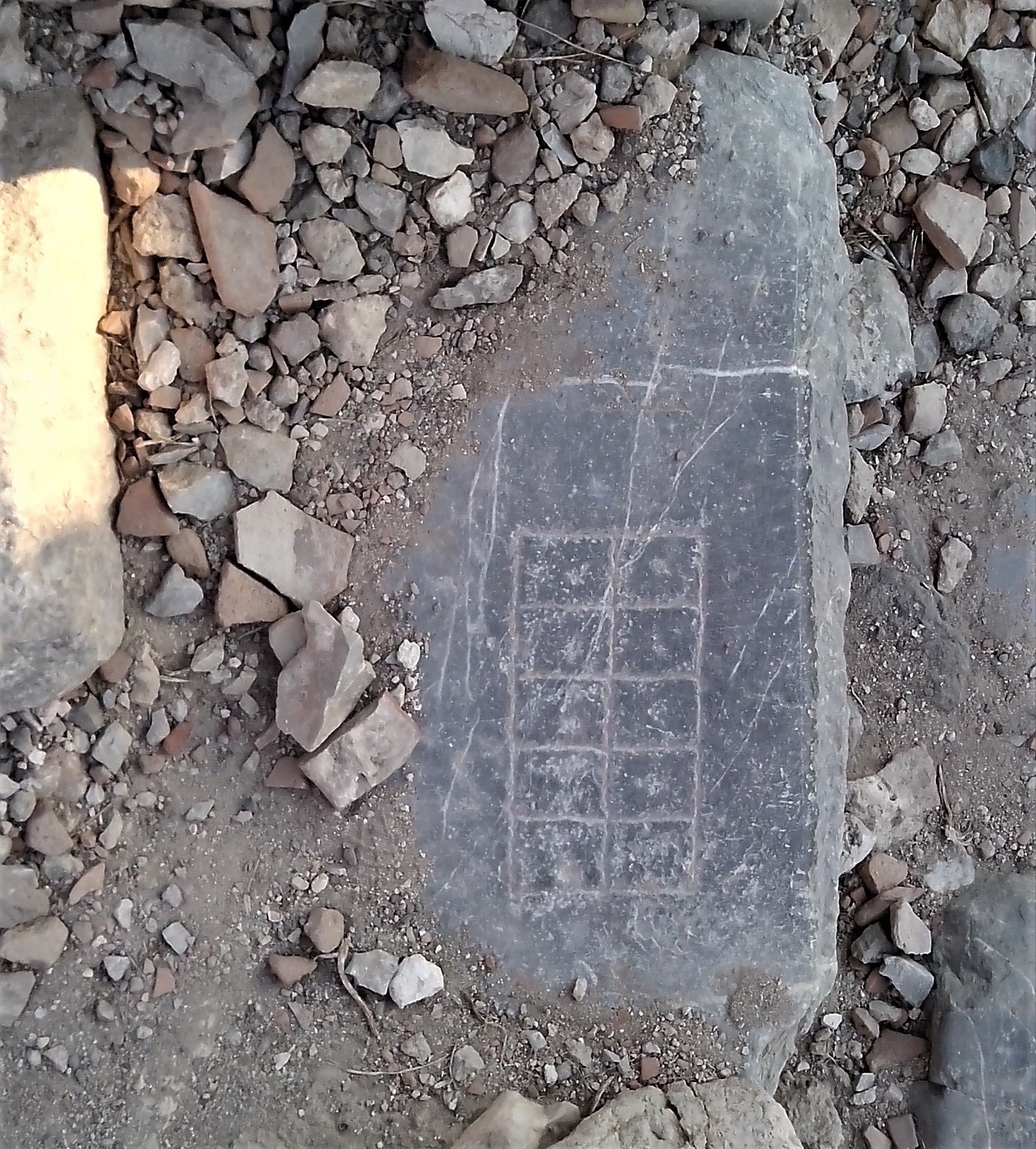 Ancient carved gaming board at the steps of the main road of the ancient city of Knidos in Caria, Turkey. 